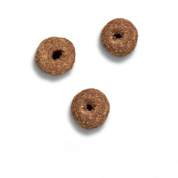 Three round, brown pet treats with a hole in the center, displayed on a white background.