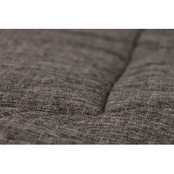 Nahaufnahme eines strukturierten, dunkelgrauen Haustierbettstoffs, der seine weiche, gepolsterte Oberfläche zeigt.