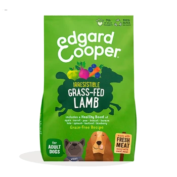 Green bag of Edgard Cooper dog food labeled "Irresistible Grass-Fed Lamb," featuring veggies, fruits, and a grain-free recipe for adult dogs.