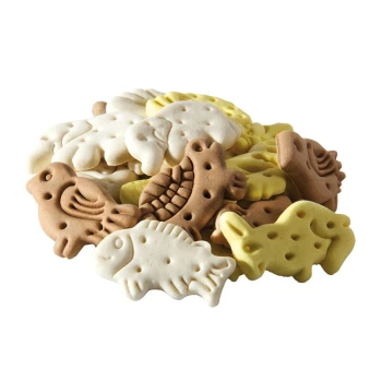 Megapack pâtisseries 10 kg Mélange animal Une pile de friandises pour animaux colorées en forme de divers animaux, y compris des poissons, des oiseaux et des éléphants, dans des teintes de marron, blanc et jaune.