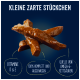 Friandises pour chiens Kleine zarte Stückchen, avec le texte : "Vitamine D & E," "100% complet et équilibré," "Source d'acides gras oméga-6."