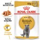 Emballage de nourriture pour chats Royal Canin Adult British Shorthair, mettant en avant un chat gris et soulignant la nutrition spécifique à la race et l'énergie.