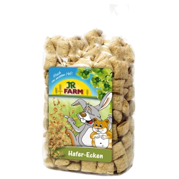 A clear bag of square oat treats for pets, with a colorful label featuring a cartoon rabbit and hamster, labeled "JR FARM Hafer-Ecken."
