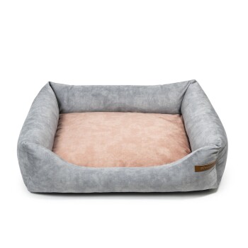 Graues Haustierbett mit einem weichen rosa Kissen, mit erhöhten Seiten für Komfort und einem kleinen braunen Etikett an der Seite.