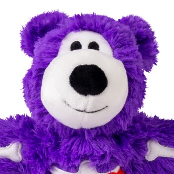 Purple plush teddy bear with white snout, black nose and eyes, smiling face, soft furry pet toy