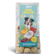 Hundeleckerli-Verpackung mit "Kokos Crunchies" mit einem Bild eines glücklichen Hundes, Kokosnuss und Früchten; der Text hebt die Zutaten und Qualität hervor.