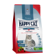 Sac de nourriture pour chats Happy Cat Adult Indoor présentant un chat gris, étiqueté "Voralpen Rind | Bavarian Beef", avec un texte sur le contrôle des boules de poils et du poids.