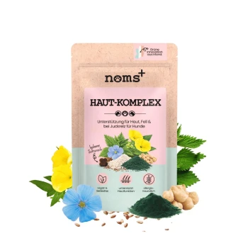 Haut & Fell Komplex für Hunde 200g noms+ Beutel mit der Aufschrift 'HAUT-KOMPLEX' Hautergänzung für Hunde mit Blumen, grünem Pulver, Samen und Kichererbsen.