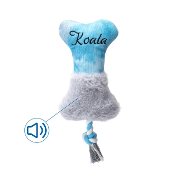 Blauer Plüschhundespielzeug in Form eines Knochens, beschriftet mit "Koala", mit einem flauschigen Boden und einem geknoteten Seilschwanz; mit einem Geräuschsymbol.
