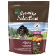 Braune Hundefuttertüte mit einem Hund auf der Vorderseite, beschriftet mit "Real Nature Country Selection Alpine," mit Zutaten, die auf Deutsch und Englisch aufgelistet sind.