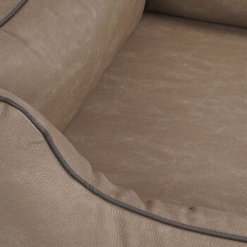 Nahaufnahme eines weichen, braunen Haustierbettes mit einer strukturierten Oberfläche und kontrastierendem dunklen Rand, ideal für den Komfort von Haustieren.