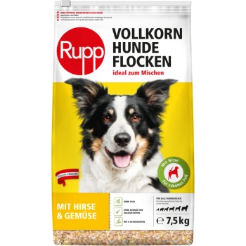 Hundefutterverpackung mit einem lächelnden Hund, beschriftet mit "Rupp Vollkorn Hunde Flocken", ideal zum Mischen, mit Hirse und Gemüse für alle Rassen.