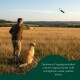 Grüner Canvas-Hundetrainingsdummy mit Seil und Knebel, beschriftet mit "R" und "Ruffwear"-Etikett.