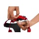 Eine Person passt ein rotes Hundegeschirr an und zeigt ein Metallschild mit der Aufschrift "RUFF WEAR 888-783-3962."