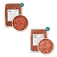 Zwei Pakete BARF Komfort PLUS Tiernahrung, eines mit der Aufschrift '500 g' und das andere '609 g', mit einer Schüssel rohem Fleisch in der Mitte.