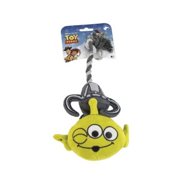 Green Toy Story alien plush dog toy with braided rope and knot, attached to packaging card reading "Toy Story" with Woody