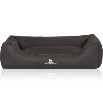 Ein dunkelbraunes Hundebett mit einer weichen, strukturierten Oberfläche und erhöhten Rändern, mit dem Logo "KNUFFELWUFFF" deutlich sichtbar.