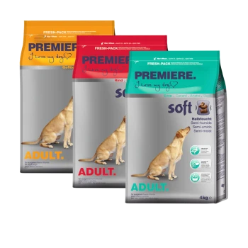 Drei Beutel Hundefutter mit der Aufschrift "Premiere" in verschiedenen Geschmacksrichtungen: orange für Huhn, rot für Rind und grün für Ente, alle mit "Erwachsene" und "weich" gekennzeichnet.