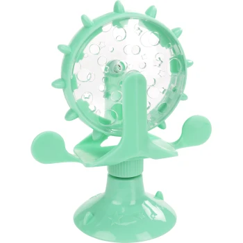 Miętowo-zielona zabawka dla zwierząt z przezroczystą okrągłą komorą bąbelkową, z wycięciami w kształcie gwiazdy i koła, zamontowana na podstawie ssącej.