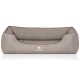 Ein plüschiges, graues Hundebett mit geripptem Design und erhöhten Seiten, mit dem Logo "KNUFFELWUFFF" prominent auf der Vorderseite.