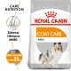 Torba karmy dla psów Royal Canin Coat Care Mini z ilustracją uśmiechniętego psa, z tekstem podkreślającym odżywianie i korzyści dla zdrowej sierści.
