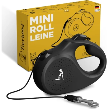 Rollleine Katze und kleine Hunde S Schwarze ausziehbare Hundeleine mit einem Griff, neben einer gelben Box mit der Aufschrift "MINI ROLL LEINE" und "Tierhood", entwickelt in Deutschland.