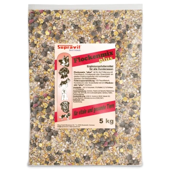 Nahaufnahme von gemischtem Vogelfutter mit gelben Flocken, braunen Pellets, roten und grünen Stücken sowie weißen Körnern.