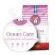 Hundetrockenfutterbeutel mit der Aufschrift 'Ocean Care' im pink-weißen Streifenmuster, mit Symbolen für hypoallergen, glutenfrei, Mono-Protein und Lachs.