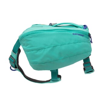 Ein türkisfarbener Hunderrucksack von Ruffwear, mit verstellbaren Riemen und einem oberen Griff für einfaches Tragen.