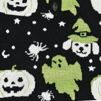 Black pet sweater fabric with green ghost, white jack-o'-lanterns, spiders, stars and a dog in a witch hat pattern.