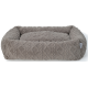 Un lit pour animaux de compagnie en peluche gris avec un motif en diamant texturé et des bords surélevés, conçu pour le confort et le soutien.