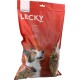 Rote LECKY-Hundekeks-Tüte (Schweizer) mit Aufschrift 'Cocktail', Foto eines Hundes und sichtbaren mehrfarbigen Keksen.