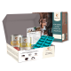 Wildfang Hundefutter Starterset mit Dosenrind und Huhn, knochenförmiger Silikonform und Informationsblatt.