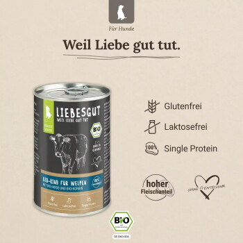 LIEBESGUT Bio‑Dose mit Rind für Welpen, mit Kuhbild, 'Weil Liebe gut tut' und Labels: 'Glutenfrei', 'Laktosefrei'.