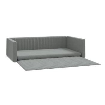 Graues Haustiersofa mit einer abnehmbaren gesteppten Matte, mit einer niedrigen Rückenlehne und Seitenkissen für Komfort.