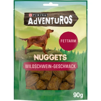 Purina AdVENTUROS Hundeleckerlis, 90g Packung, mit einem Golden Retriever auf einem Berg, beschriftet mit "NUGGETS" und "WILDSCHWEIN-GESCHMACK."