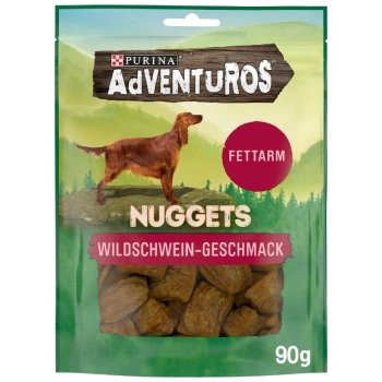 Friandises pour chiens Purina AdVENTUROS, paquet de 90 g, avec un golden retriever sur une montagne, étiqueté "NUGGETS" et "WILDSCHWEIN-GESCHMACK."