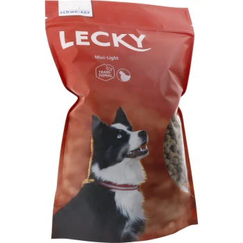 Sac rouge de nourriture pour chiens LECKY Mini-Light avec un chien noir et blanc aux yeux bleus sur le devant, montrant des croquettes à travers une fenêtre transparente.