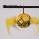 Yellow plush cat toy ball with black star design and attached yellow feathers hanging from a black rod.