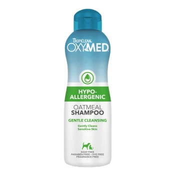 TropiClean OxyMed Oatmeal Shampoo bottle with a blue cap and green label, designed for gentle cleansing of sensitive skin.