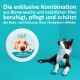 Nasen- und Schnauzenbalsam von GREEN HERO, mit einem Hund, der das Produkt vor einem türkisfarbenen Hintergrund betrachtet.