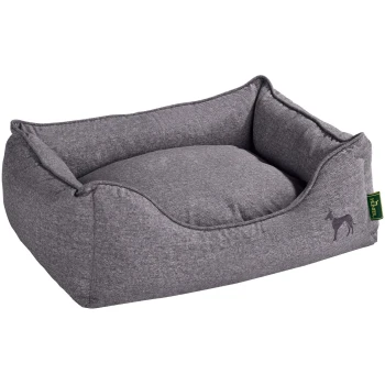 Hundesofa Boston grau S Graues Haustierbett mit erhöhten Rändern und einem weichen Kissen, mit einer kleinen Hundesilhouette und einem grünen Etikett mit der Aufschrift "Hunter."
