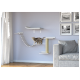 Un chat tigré joueur explore un système d'escalade pour chats moderne monté au mur avec des étagères et un griffoir, à côté d'un canapé gris confortable.