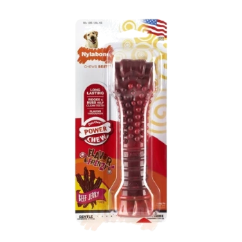 Red Nylabone dog chew toy in packaging, labeled "Power Chew" with "Beef Jerky Flavor," featuring ridges for dental cleaning.