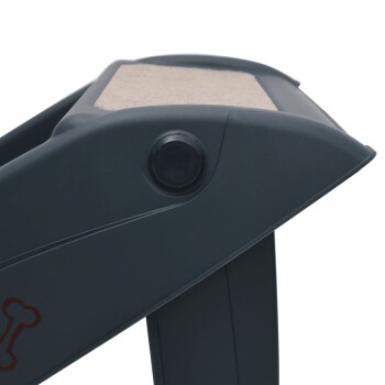 Nahaufnahme eines grauen Haustierpflegewerkzeugs mit einer strukturierten Oberfläche und einem Knopf, mit einem roten Knochenlogo an der Seite.