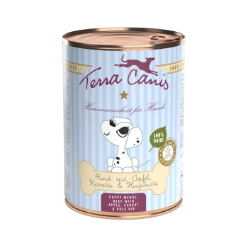 Une boîte de nourriture pour chien Terra Canis avec un chien de dessin animé, étiquetée "Puppy-Menü: Bœuf avec Pomme, Carotte & Églantier," et "100% Natur."
