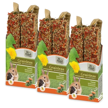 Drei JR FARM Getreidefreie Tierfutterpackungen mit bunten Kräutersticks für Kaninchen und Meerschweinchen, die Löwenzahn- und Wildblumensamen enthalten.