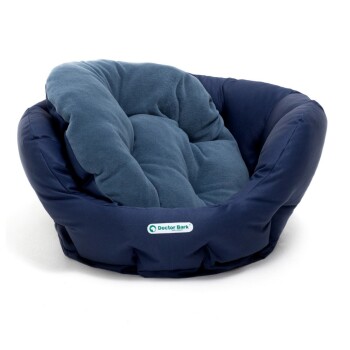 Ein gemütliches, rundes Haustierbett in Marineblau mit einem plüschigen, gepolsterten Innenraum, mit dem Logo "Doctor Bark" an der Seite.
