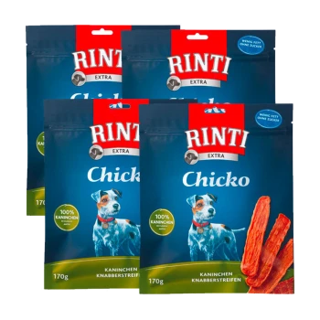 Vier Beutel Rinti Extra Chicko Hundeleckerlis, mit einem blauen Hintergrund, einer Hundillustration und dem Text '100% Kaninchen' und '170g.'