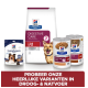 Hill's Prescription Diet für Hunde: Digestive Care Trockenfutter, hypoallergene Leckerlis, i/d Nassfutterdosen und ein Hund auf der Verpackung.